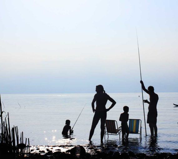 A family spending time by the lake