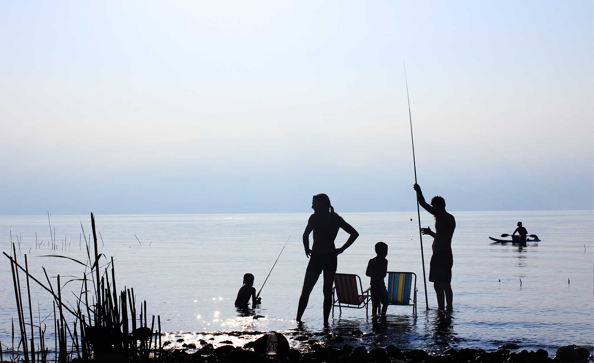 A family spending time by the lake