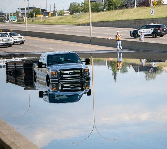 A Ford truck is stranded in flood waters.