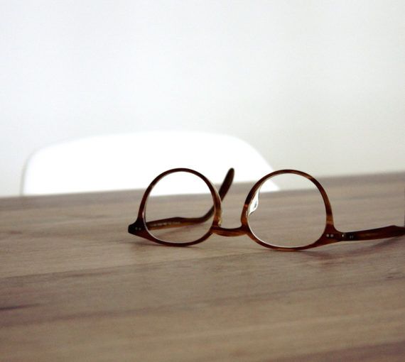 Eyeglasses resting on a table.