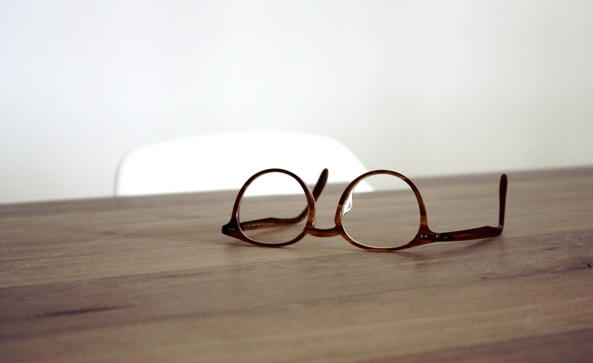 Eyeglasses resting on a table.