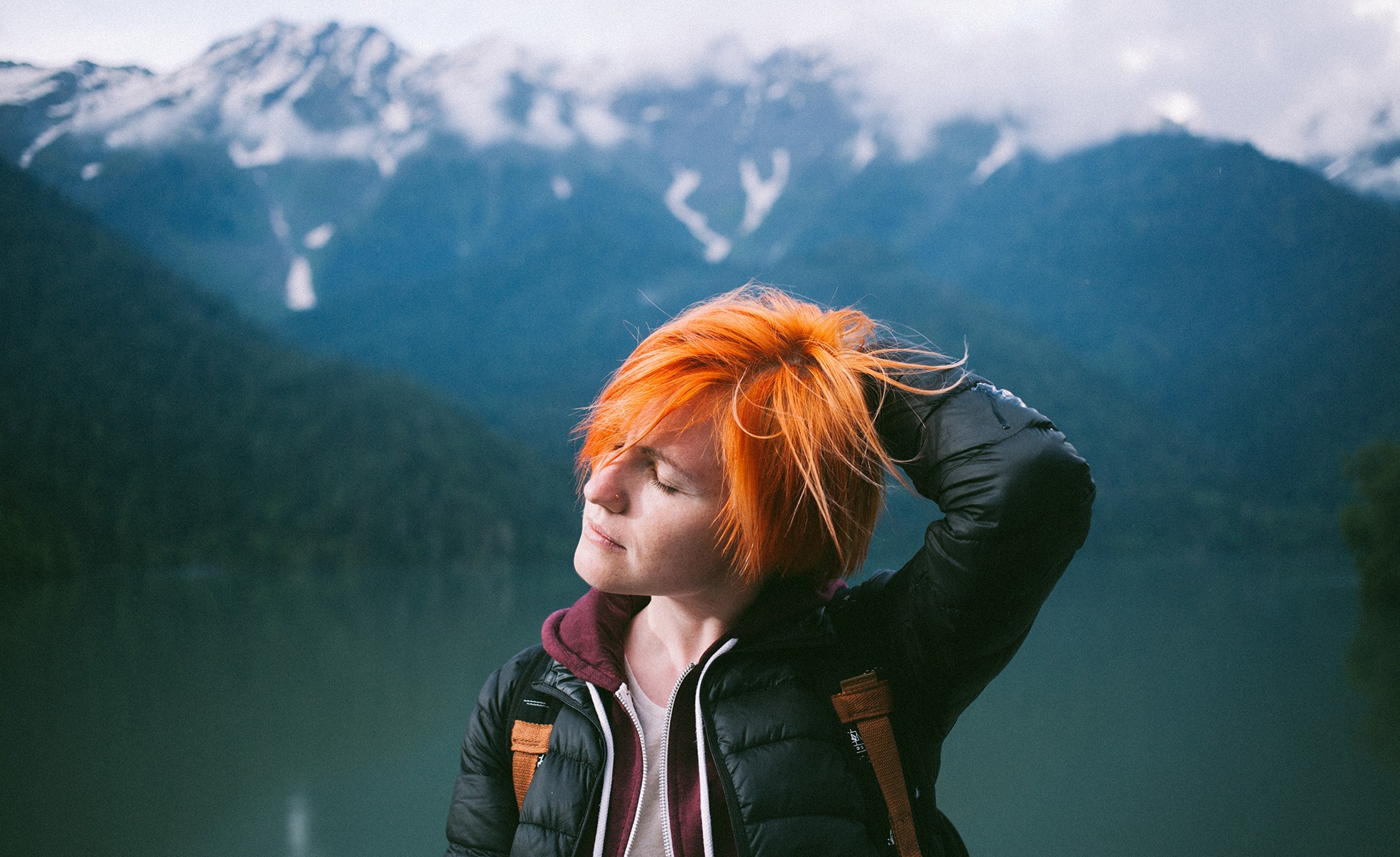 A woman with coloured hair out in nature.