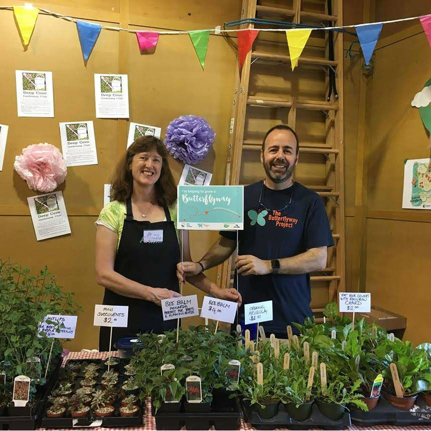 Two Butterflyway Ranger volunteers at a plant sale in Deep Cove, B.C.