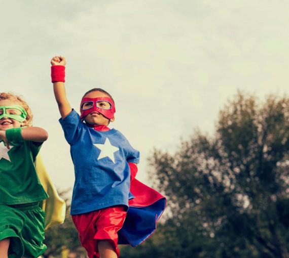 DSF connecting youth with nature resources image showing two children dressed as superheroes
