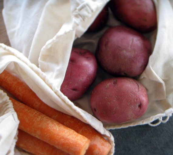 Carrots and potatos in reusable fabric produce bags