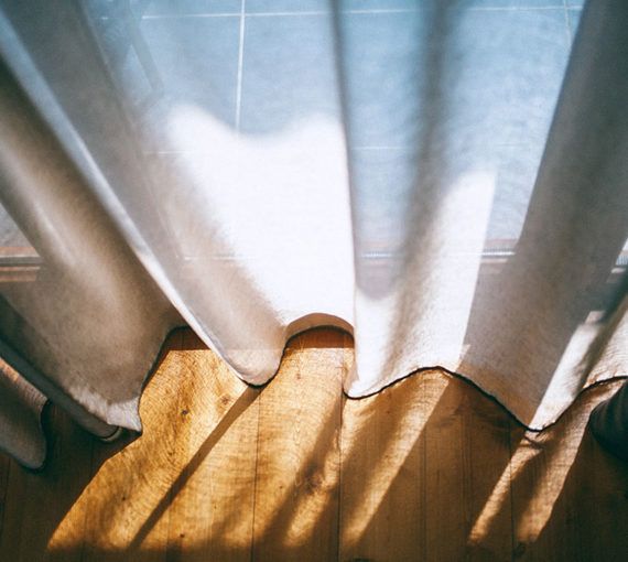 Light streaming through curtains