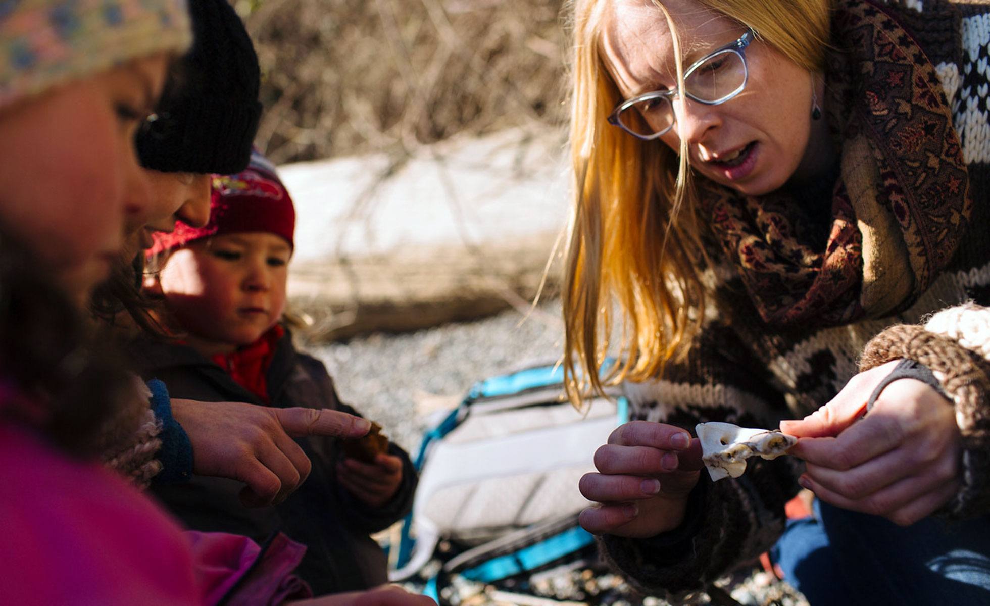 Woman leads nature lesson with young children