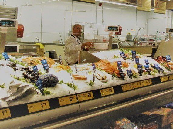 Canadians shopping for seafood at grocery store