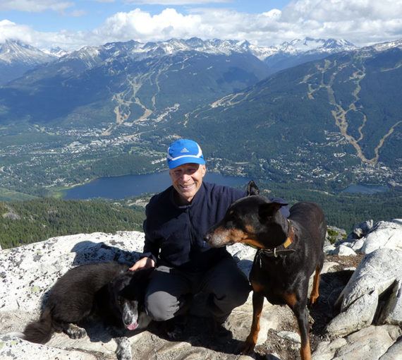 Erich with his dogs on a mountain top