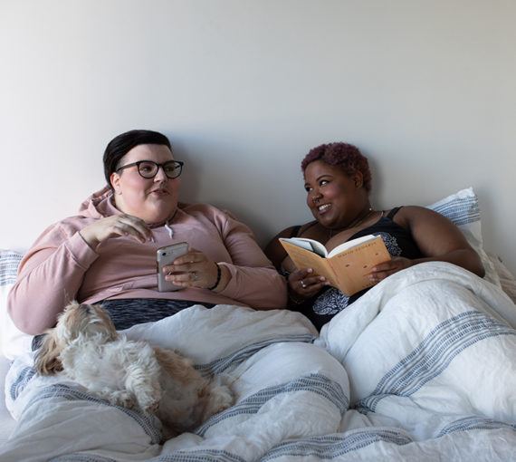 Lesbian couple at home planning how and when to vote
