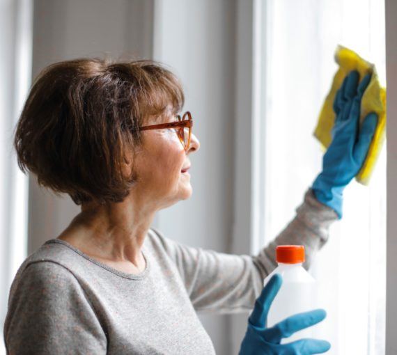 Woman cleaning a window