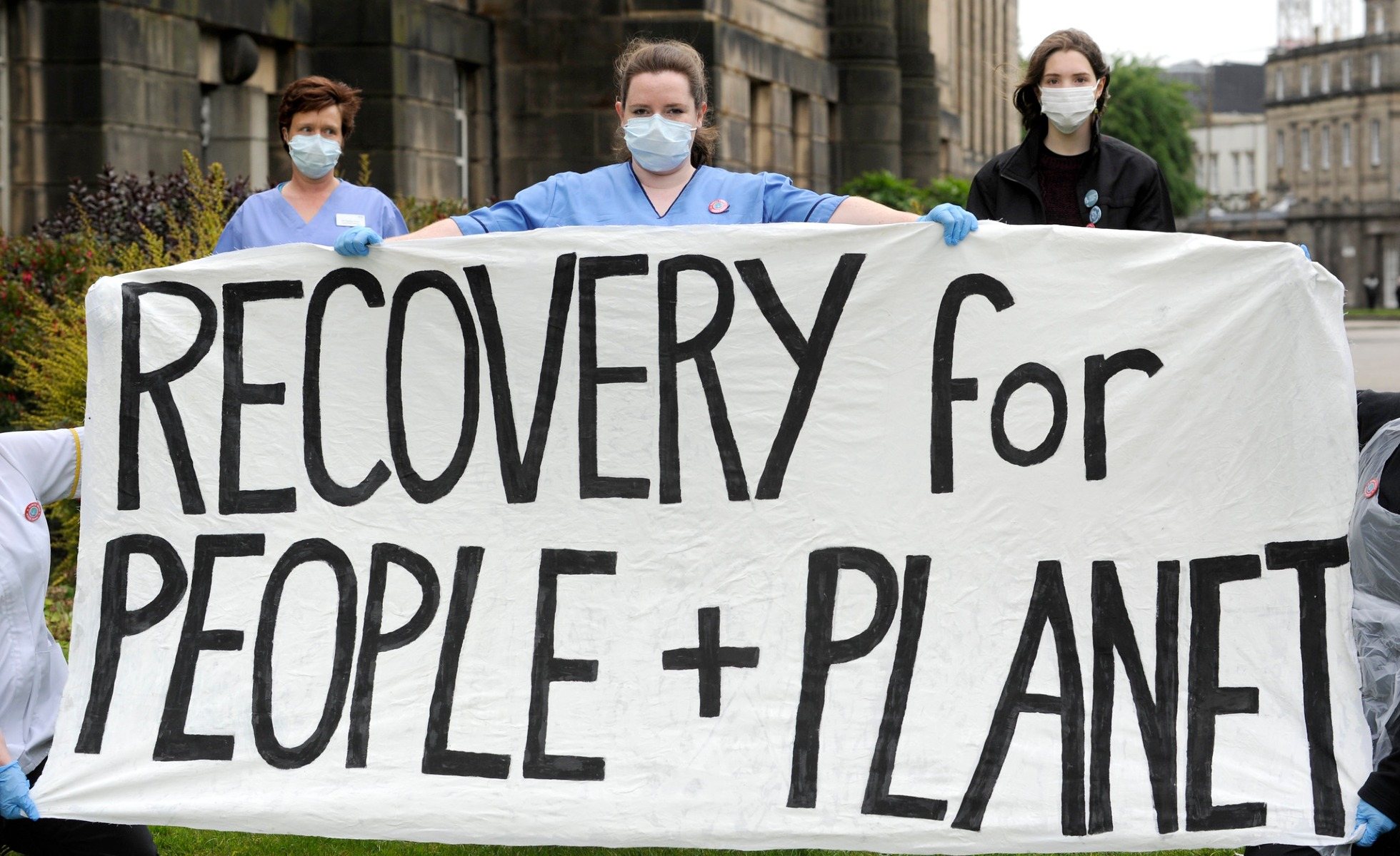 Banner reading Recovery for People + Planet from Scotland demonstration