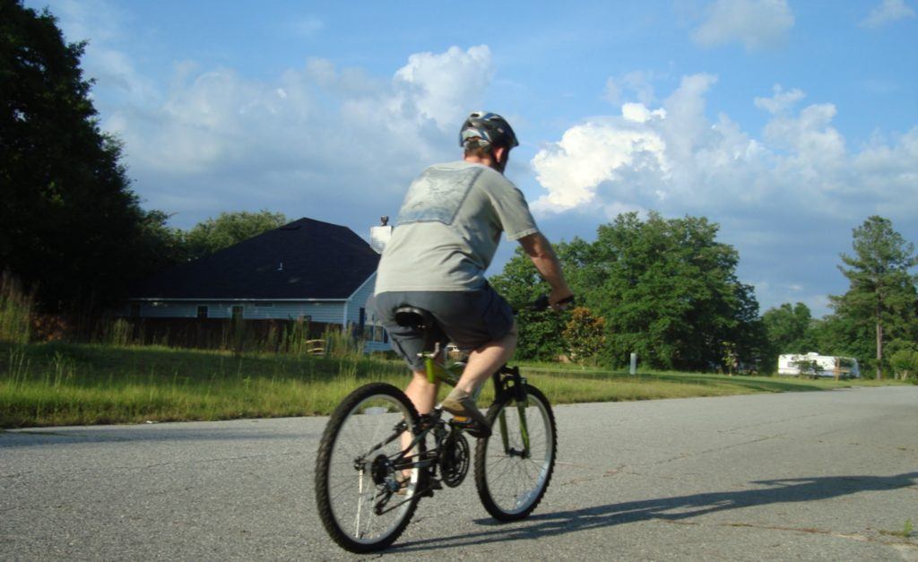 Photo of cyclist on a bike on sunny day