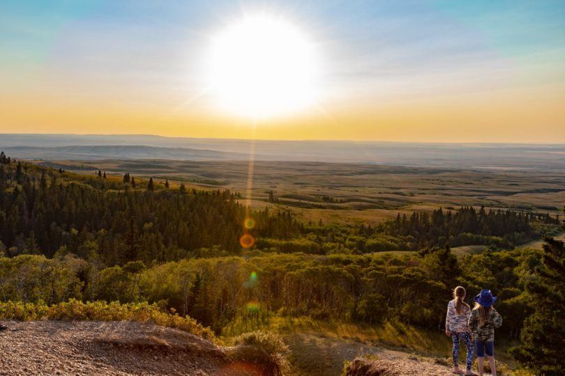 Two people looking over the horizon
