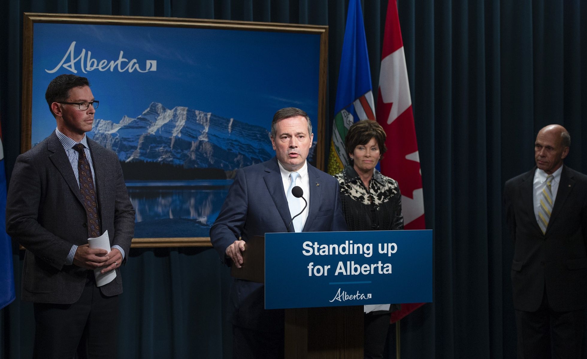 Jason Kenney announcing Public Inquiry into Anti-Alberta Energy Campaigns. He is standing in front of a podium that reads "Standing up for Alberta"