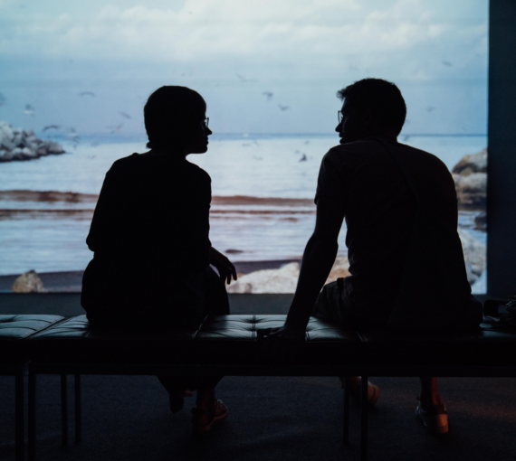 Two people talking silhouettes