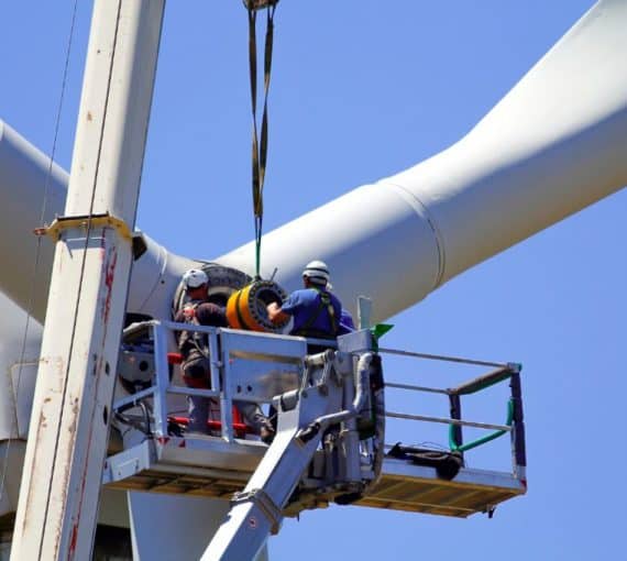 Wind turbines being repaired maintained