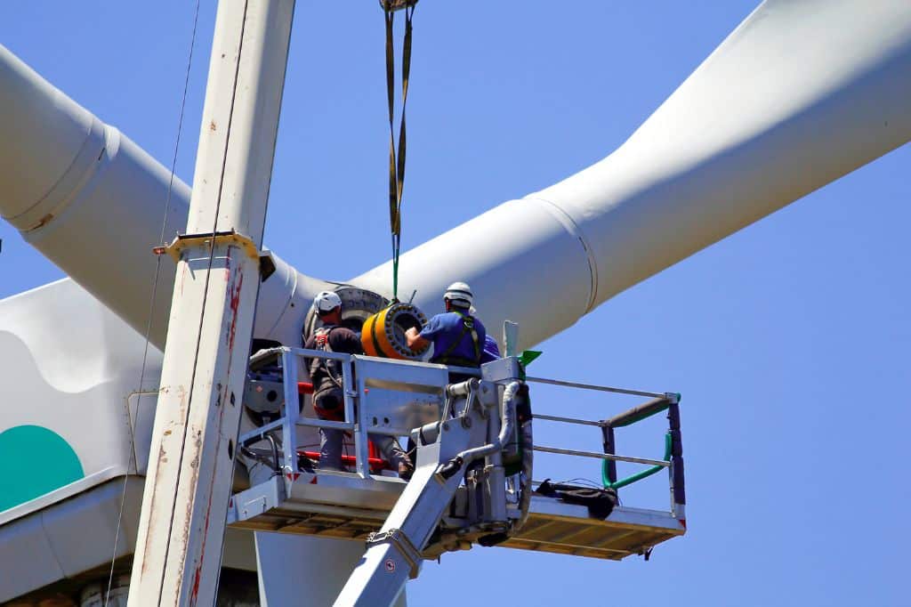 Wind turbines being repaired maintained