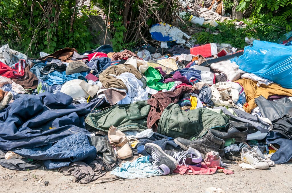 A pile of clothing and waste left discarded.