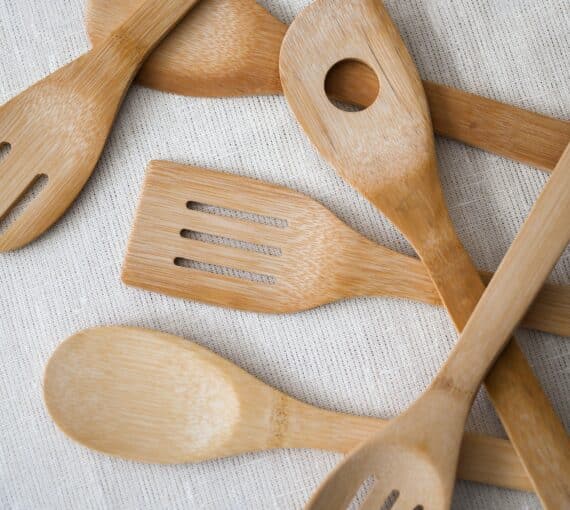 A pile of wooden kitchen utensils.