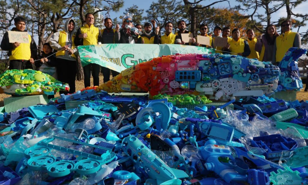 A group of activists at the Global Plastics Treaty negotiations