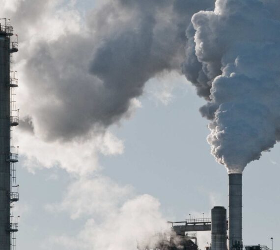 Smoke stacks against a grey sky