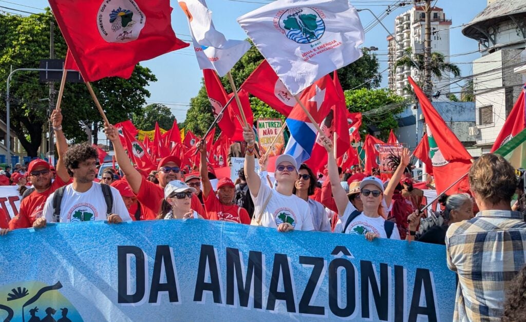 Protestors march at COP30