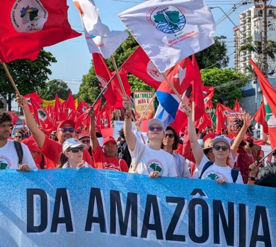 Protestors march at COP30