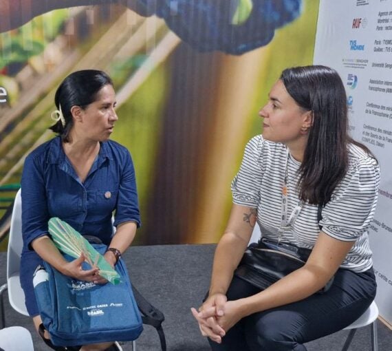 Photo: Cyrielle talks with Ines Gonzales-Salas at COP30