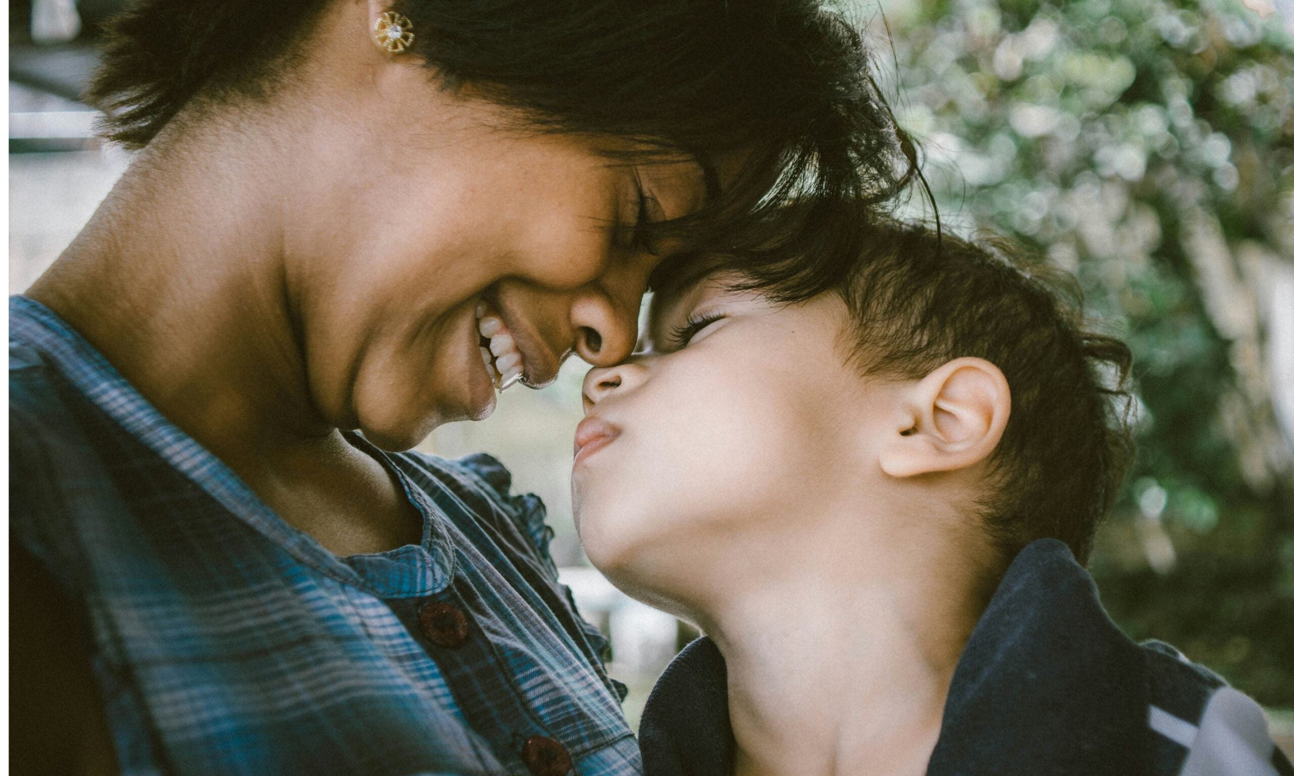 A photo of a mother and child smiling together