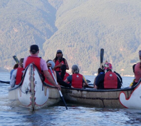 Campers in canoes learn about Squamish teachings in the middle of Howe Sound.